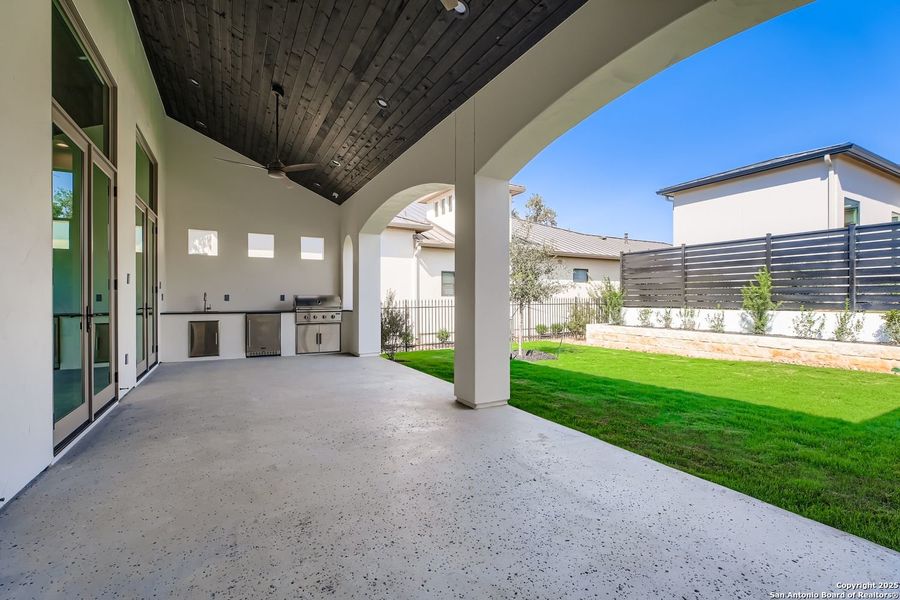 Exterior details and patio area of a home in The Bluff At The Dominion, San Antonio (Image 26).