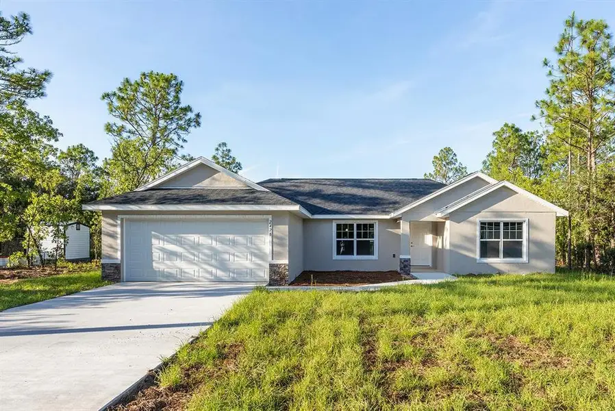 Front exterior of a new home in , Citrus Springs, FL, highlighting curb appeal (Image 1). Front exterior of a new home in , Citrus Springs, FL, highlighting curb appeal (Image 1).