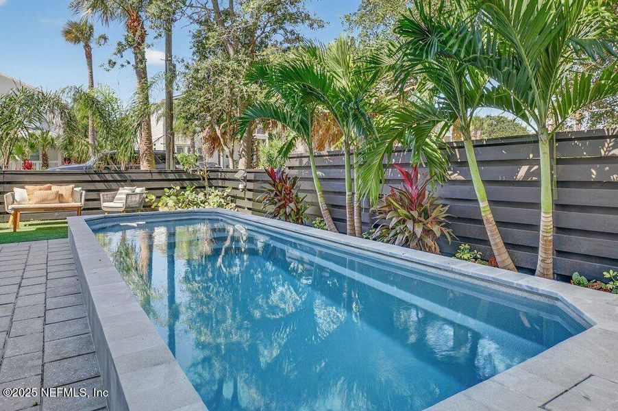 Exterior details and patio area of a home in , Neptune Beach (Image 49).