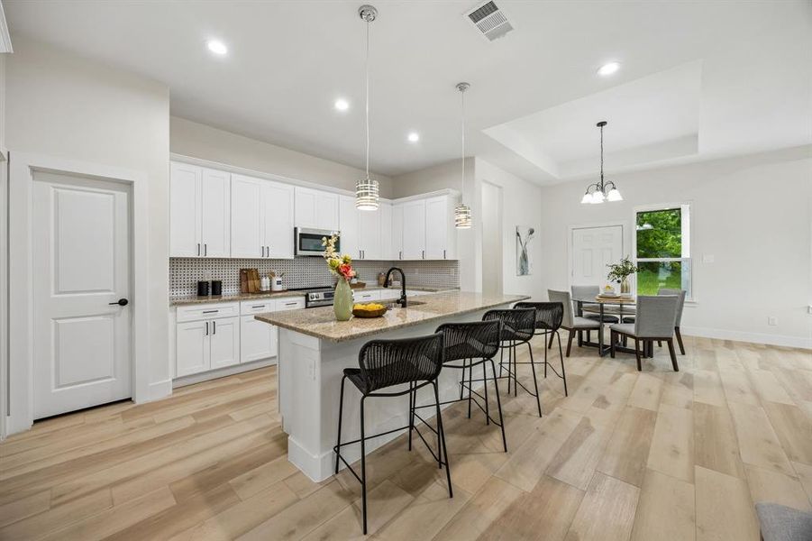 The kitchen and dining space are open to each other.