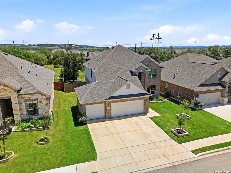 Front exterior of a new home in Ventana, Bulverde, TX, highlighting curb appeal (Image 25).
