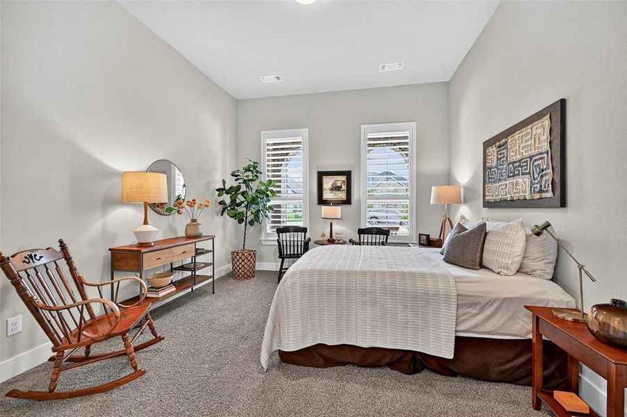 Carpeted bedroom featuring baseboards Carpeted bedroom featuring baseboards