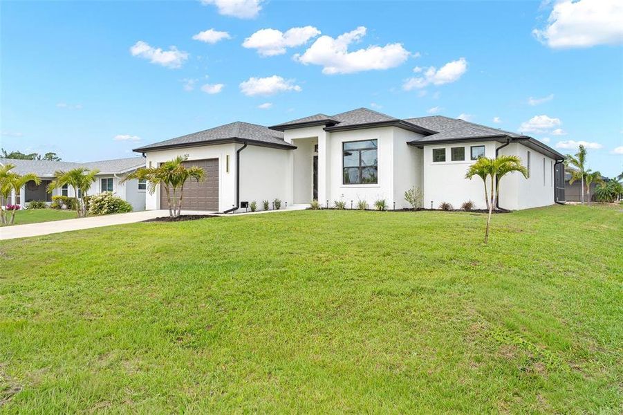 Front exterior of a new home in , Port Charlotte, FL, highlighting curb appeal (Image 2). Front exterior of a new home in , Port Charlotte, FL, highlighting curb appeal (Image 2).