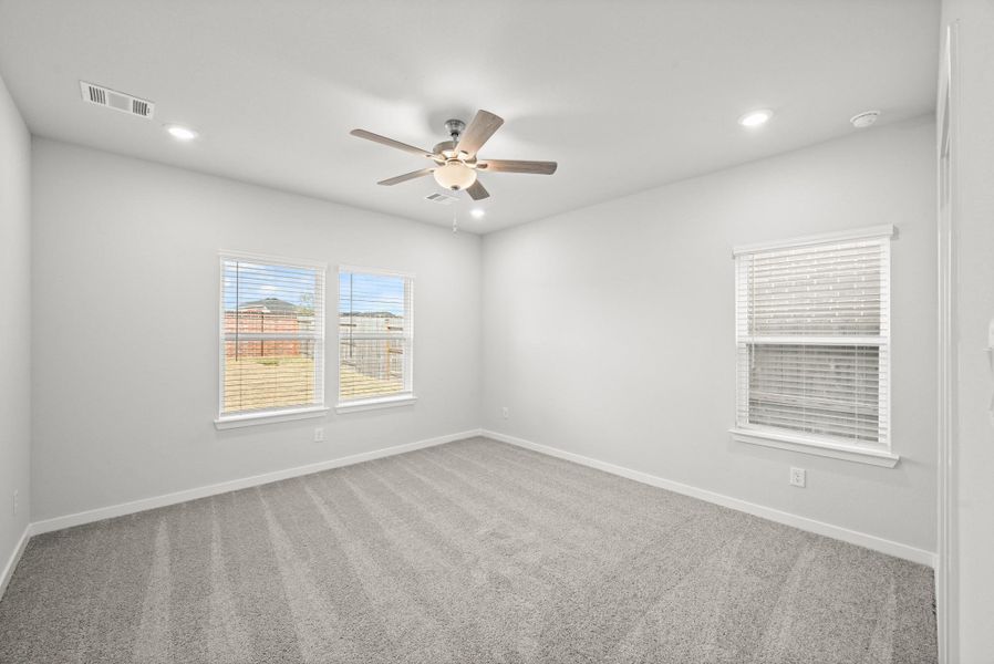 Spacious, unfurnished interior of a new home in Sunterra, Katy (Image 28).