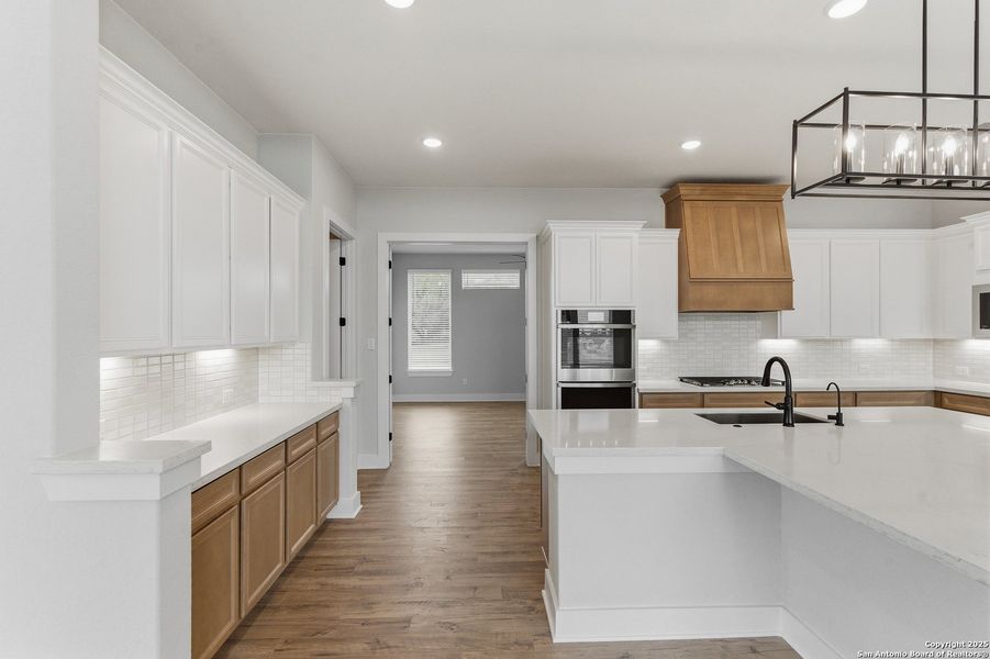 Furnished interior view inside a new home in Potranco Oaks, Castroville (Image 9).