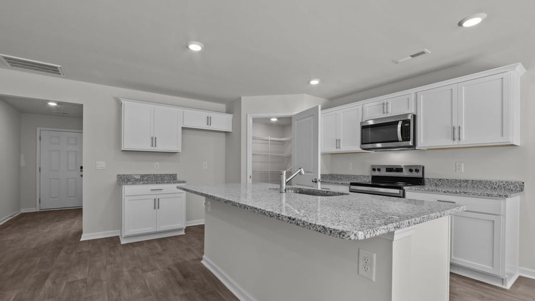 Furnished interior view inside a new home in Blair Ridge, La Grange (Image 6).