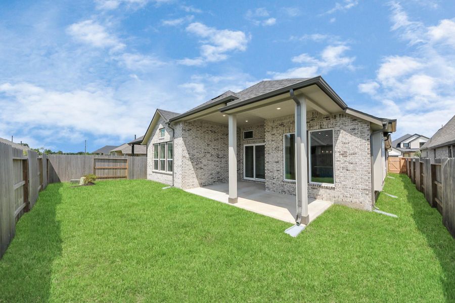 Front exterior of a new home in Amira: Heritage Collection, Tomball, TX, highlighting curb appeal (Image 17). Front exterior of a new home in Amira: Heritage Collection, Tomball, TX, highlighting curb appeal (Image 17).