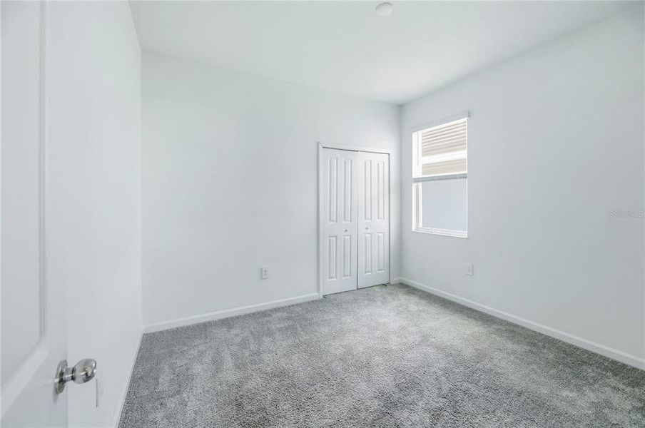 Spacious, unfurnished interior of a new home in Peace Creek Reserve, Winter Haven (Image 36).