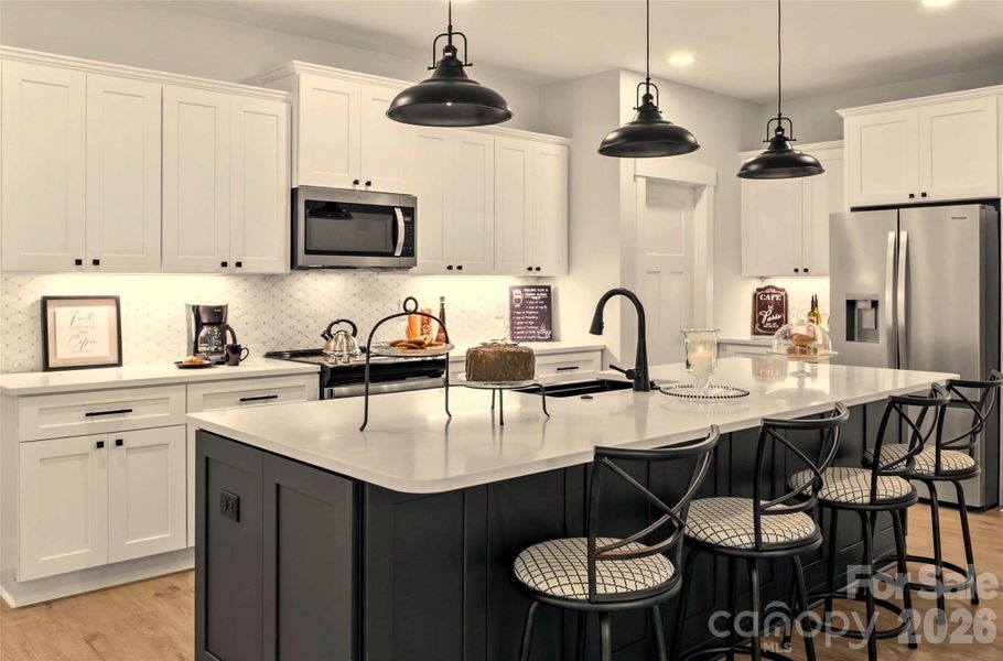 Upgraded quartz island & counters throughout.