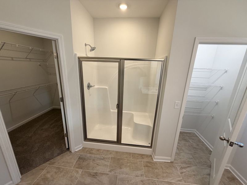 5' shower, linen closet and walk-in closet in primary bath