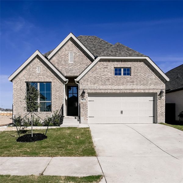 Front exterior of a new home in Juniper Springs, Lockhart, TX, highlighting curb appeal (Image 2).