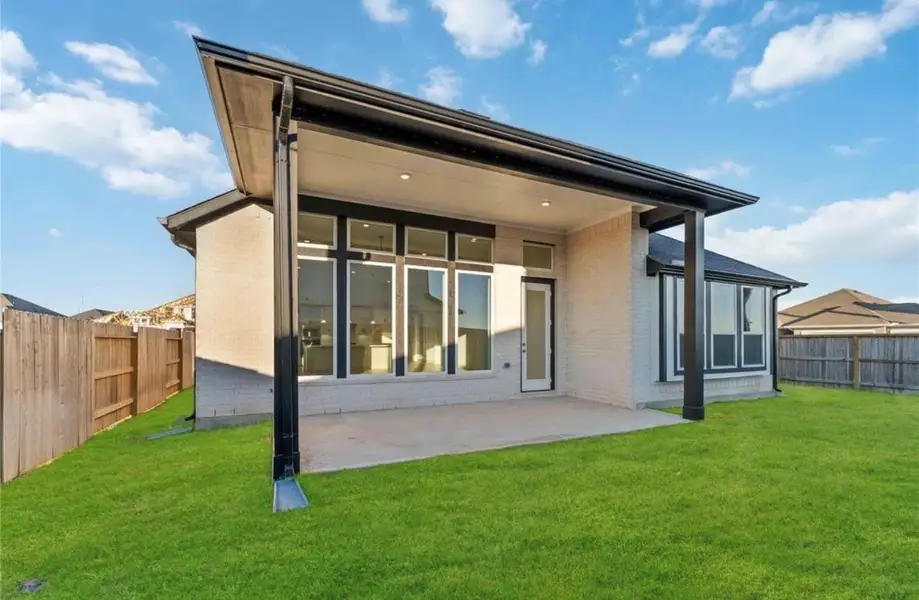 Exterior details and patio area of a home in Arabella on the Prairie, Booth (Image 3).
