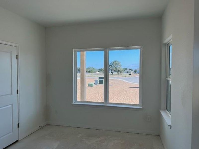 Spare room featuring unfinished concrete flooring Spare room featuring unfinished concrete flooring