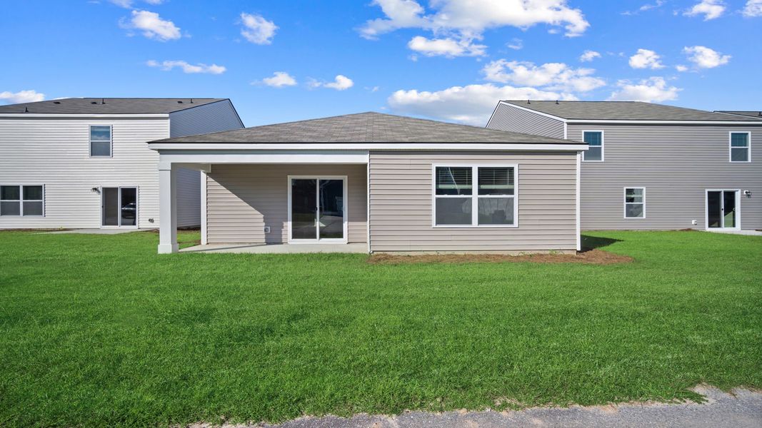 Front exterior of a new home in Rice Hope, Port Wentworth, GA, highlighting curb appeal (Image 24). Front exterior of a new home in Rice Hope, Port Wentworth, GA, highlighting curb appeal (Image 24).