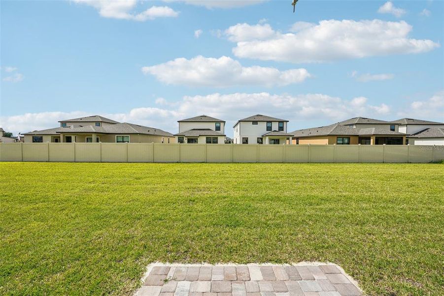 Exterior details and patio area of a home in Grasslands West, Lakeland (Image 24).