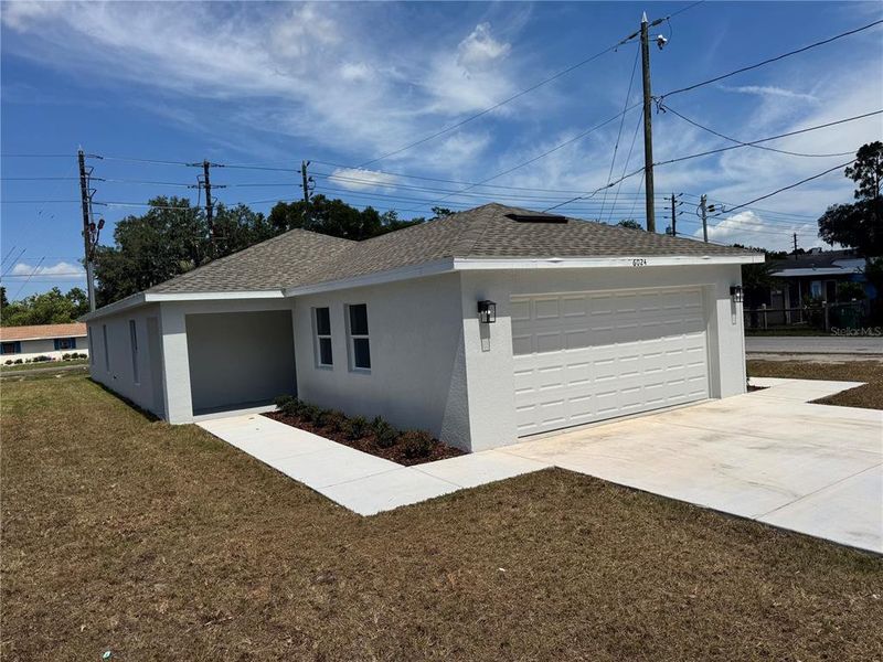 Front exterior of a new home in , Zephyrhills, FL, highlighting curb appeal (Image 26). Front exterior of a new home in , Zephyrhills, FL, highlighting curb appeal (Image 26).