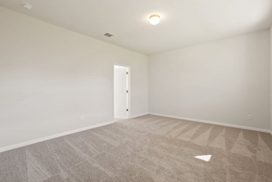 Representative unfurnished interior of a home built from the Somerville by Ashton Woods in Willow Springs, Buda (Image 32).