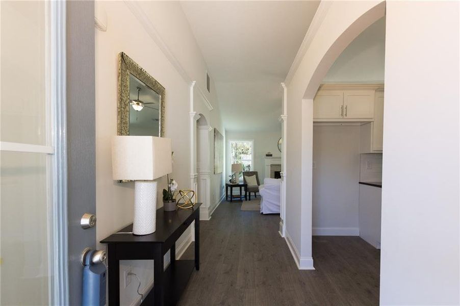 Hallway featuring dark wood-type flooring