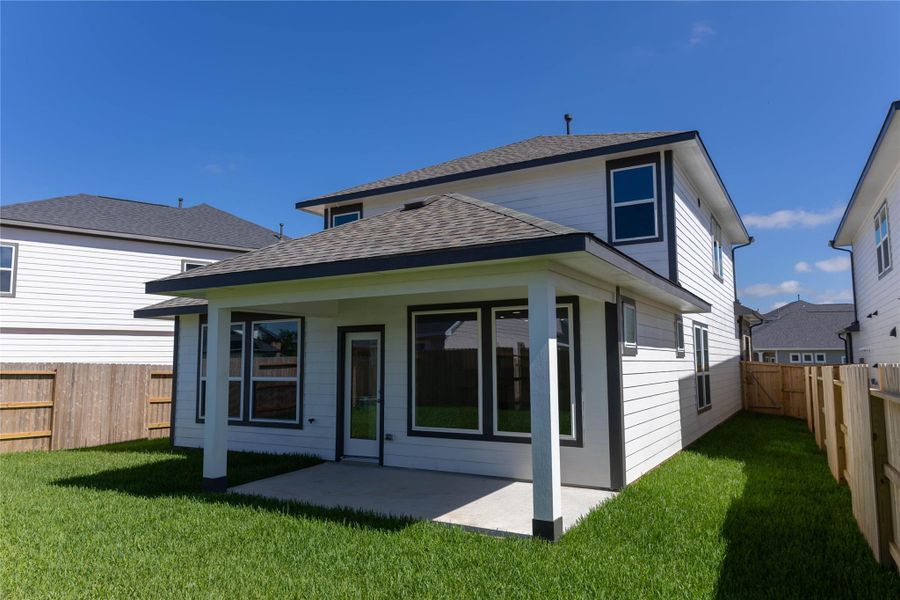 Exterior details and patio area of a home in La Segarra 40', Brookshire (Image 17).