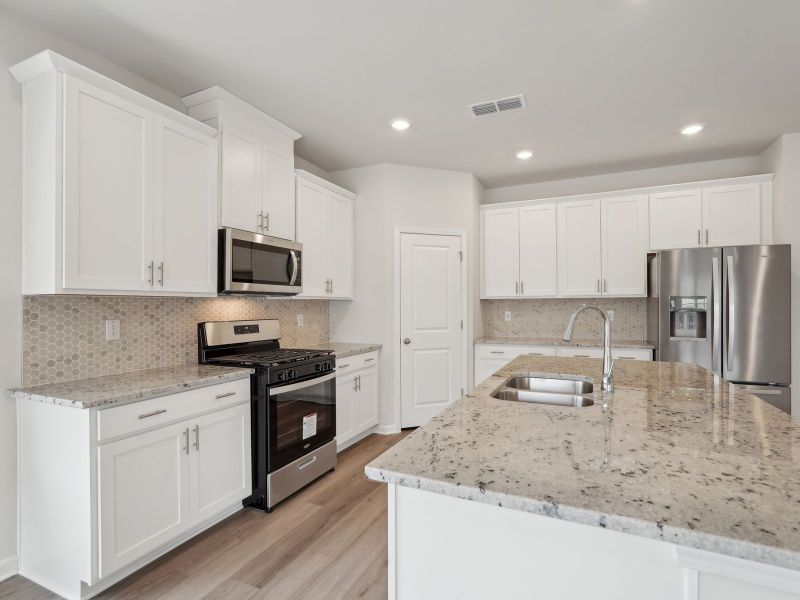 Furnished interior view inside a new home in Northwoods at Mirror Lake, Villa Rica (Image 5).