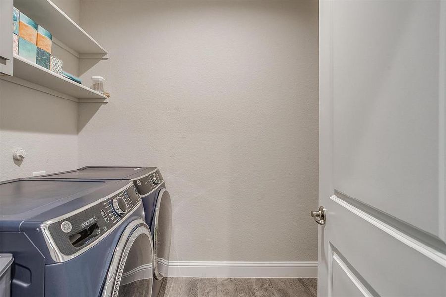 Laundry room featuring independent washer and dryer