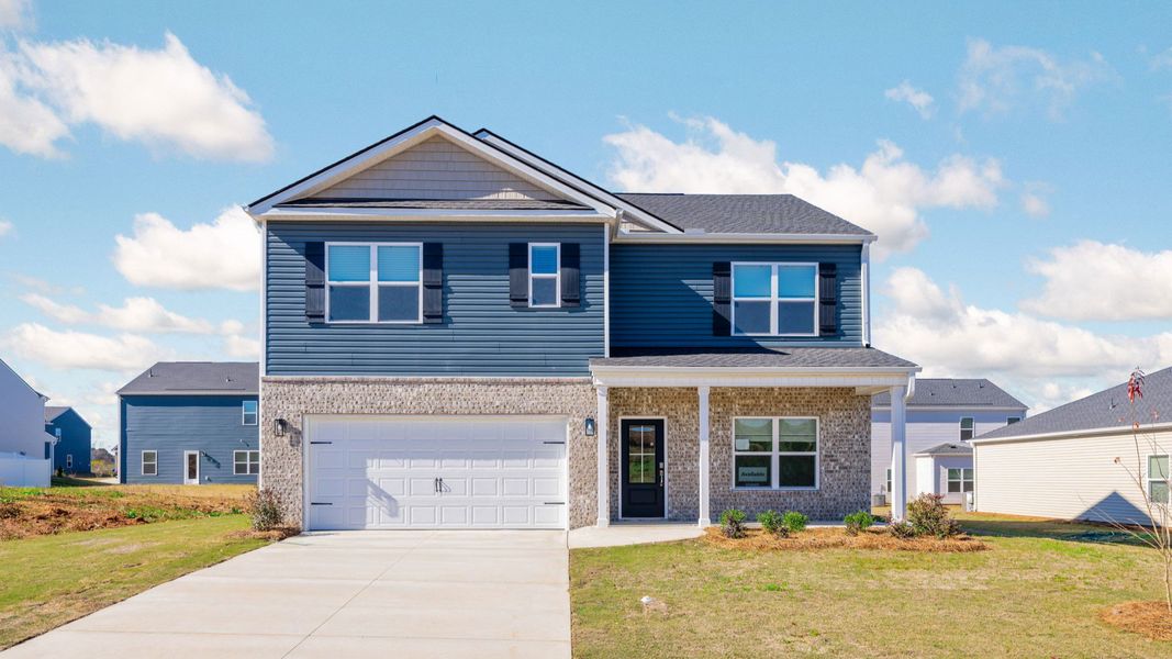 Front exterior of a new home in The Cove at Thrasher Landing, Hixson, TN, highlighting curb appeal (Image 1).
