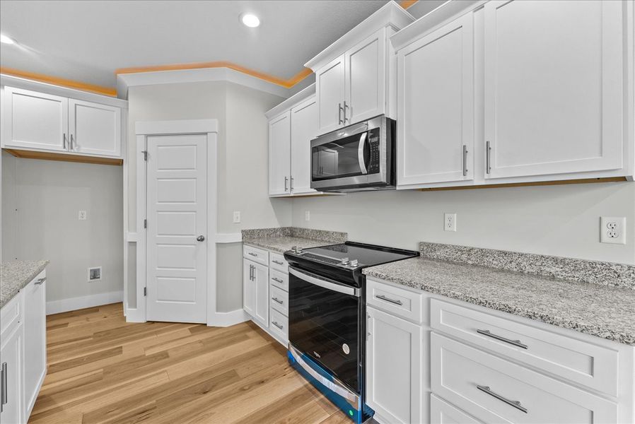 Representative furnished interior of a home built from the Emilia Elite by Enchanted Homes in Pointe Summit, Slater-Marietta (Image 9).