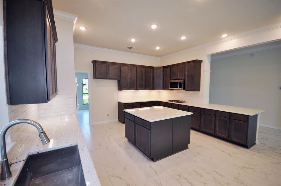 Surface mounted LED lighting and under cabinet lighting keep it bright and cheerful in the kitchen.