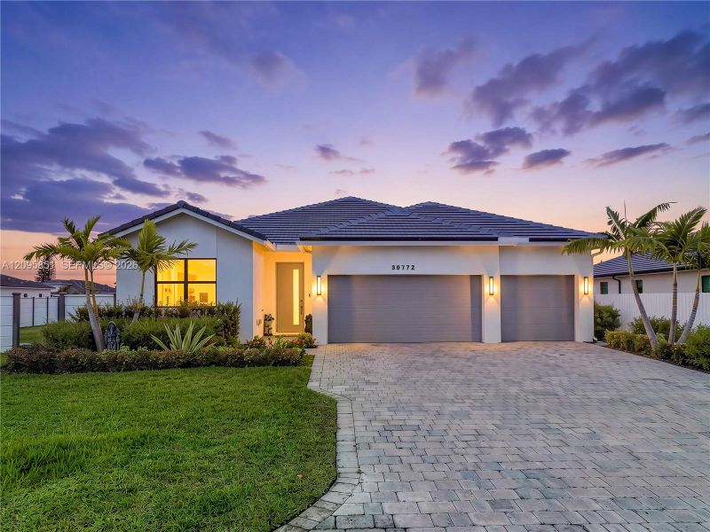 Front exterior of a new home in , Homestead, FL, highlighting curb appeal (Image 23).