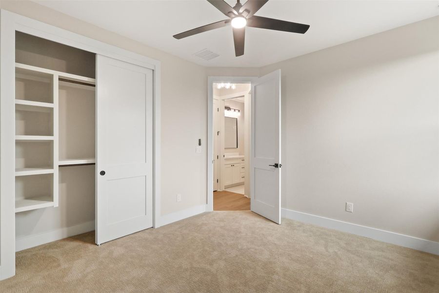 Unfurnished bedroom featuring baseboards, visible vents, a closet, and carpet flooring Unfurnished bedroom featuring baseboards, visible vents, a closet, and carpet flooring
