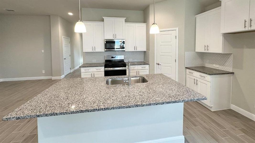 Kitchen - All Home and community information, including pricing, included features, terms, availability and amenities, are subject to change at any time without notice or obligation. All Drawings, pictures, photographs, video, square footages, floor plans, elevations, features, colors and sizes are approximate for illustration purposes only and will vary from the homes as built.