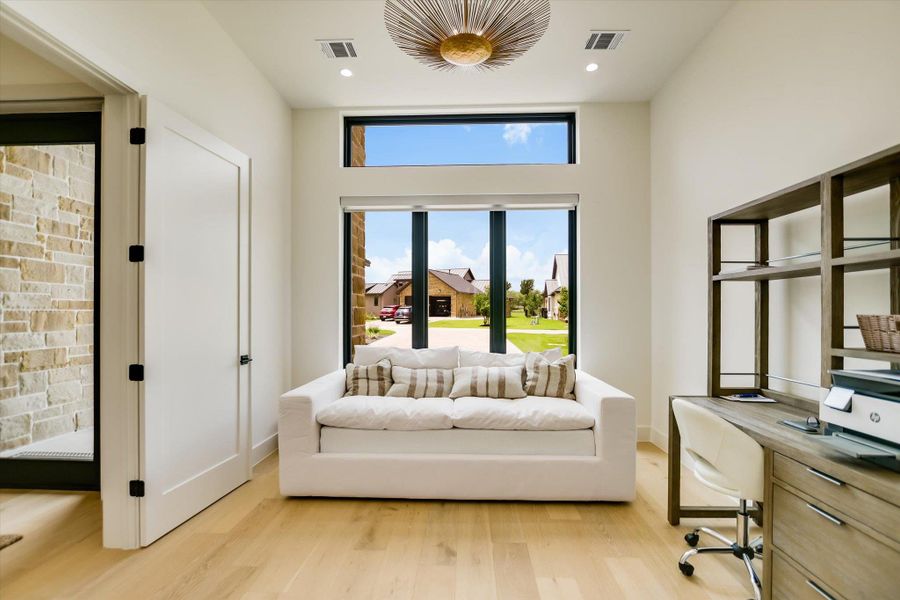 An airy office space offers abundant natural light through generous window placements.