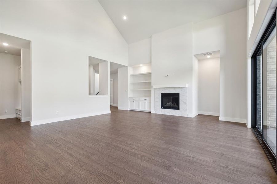 Memories are waiting to be made when the family gathers round the fireplace in this lovely family room!