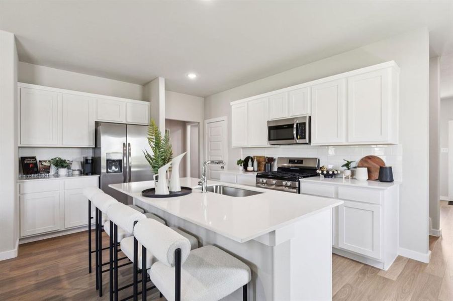Kitchen in the Magnolia home plan by Trophy Signature Homes – REPRESENTATIVE PHOTO