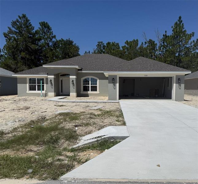 Front exterior of a new home in Citrus Springs Sub, Citrus Springs, FL, highlighting curb appeal (Image 1). Front exterior of a new home in Citrus Springs Sub, Citrus Springs, FL, highlighting curb appeal (Image 1).