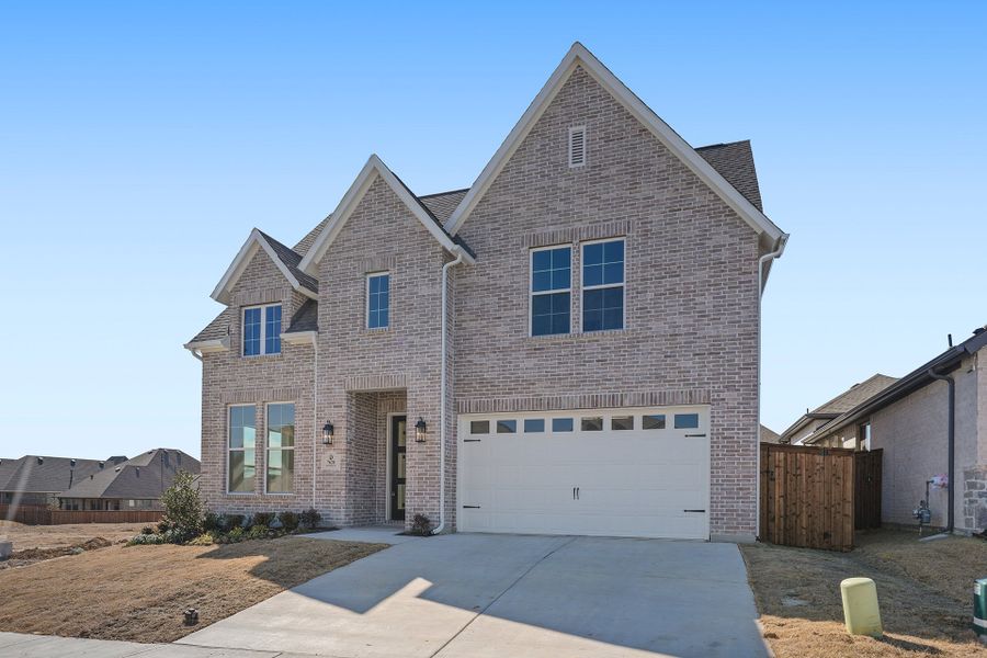 Front exterior of a new home in Tavolo Park, Fort Worth, TX, highlighting curb appeal (Image 25).