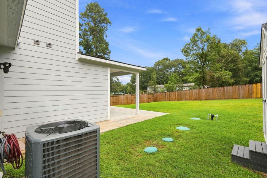 Exterior details and patio area of a home in Arrowhead Lakes, Willis (Image 4).