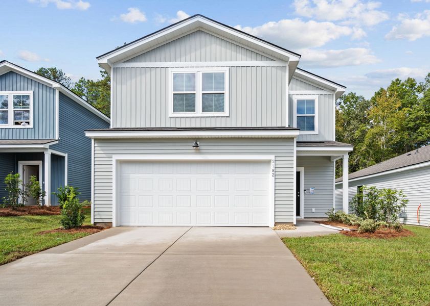 Front exterior of a new home in Grand Arbor, Blythewood, SC, highlighting curb appeal (Image 1).