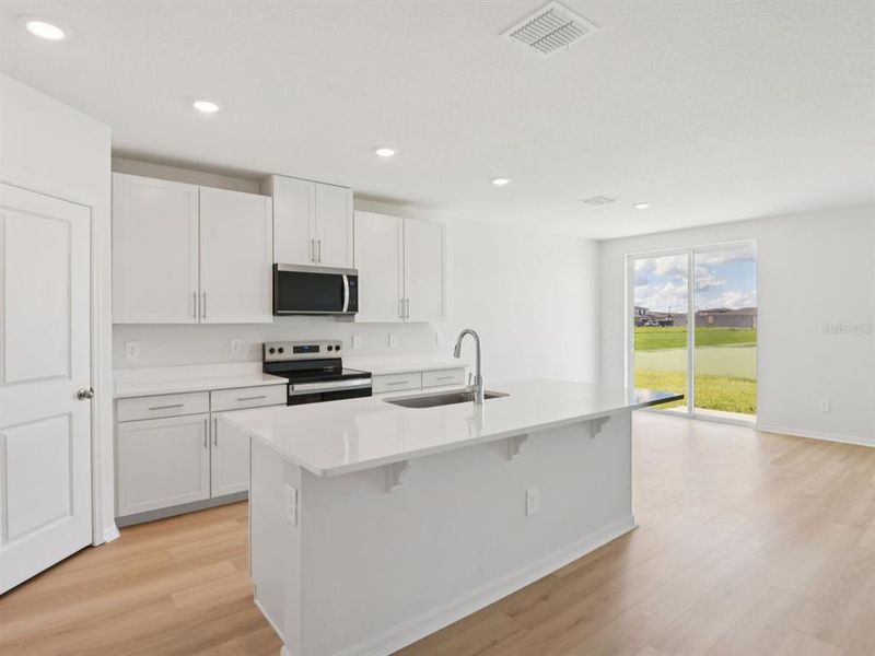 Furnished interior view inside a new home in Oakfield Trails - Classic Series, Parrish (Image 7).