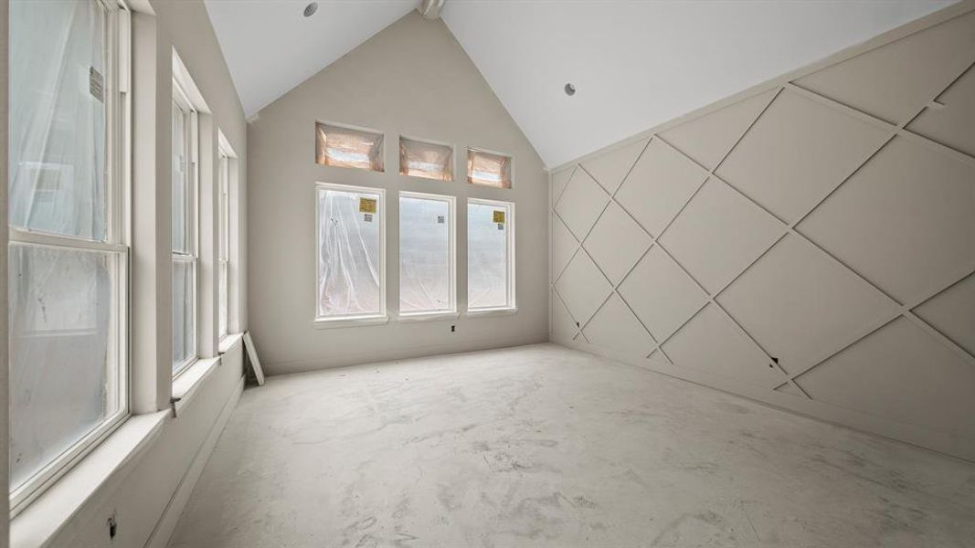 Primary bedroom with  wainscoting.