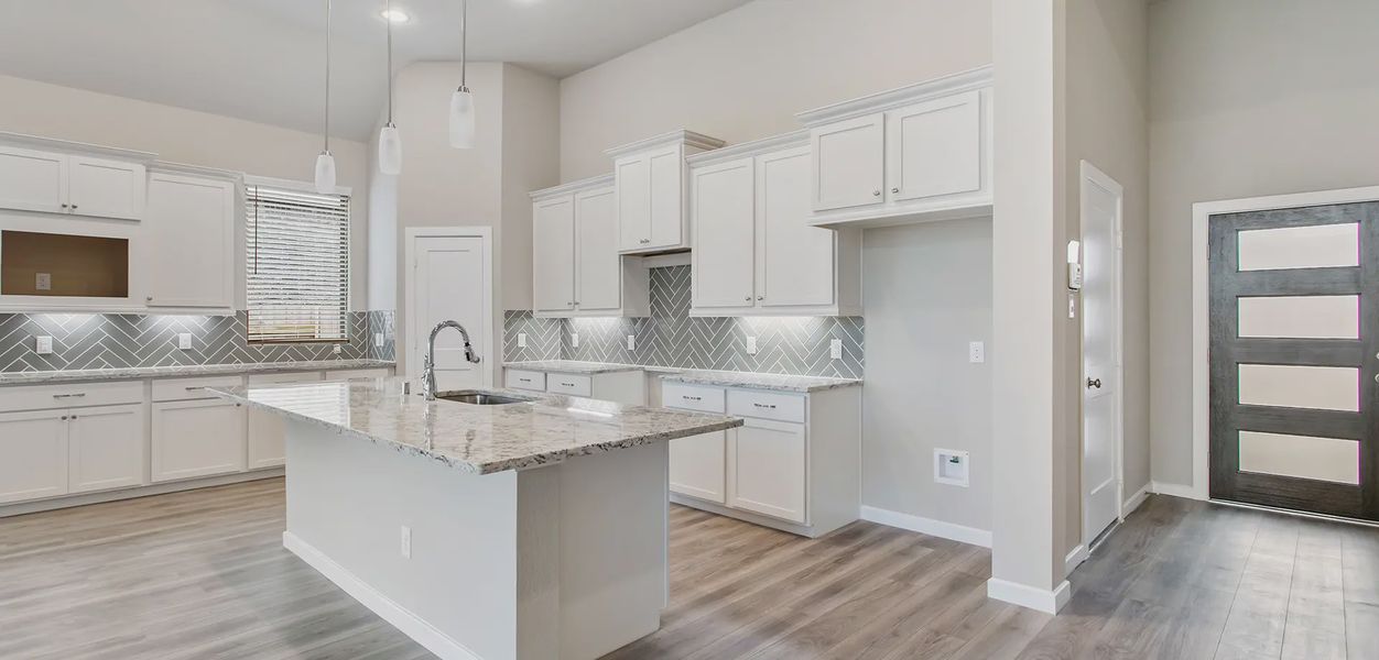 Representative furnished interior of a home built from the Sunnyside by Chesmar Homes in Wood Leaf Reserve, Tomball (Image 3).