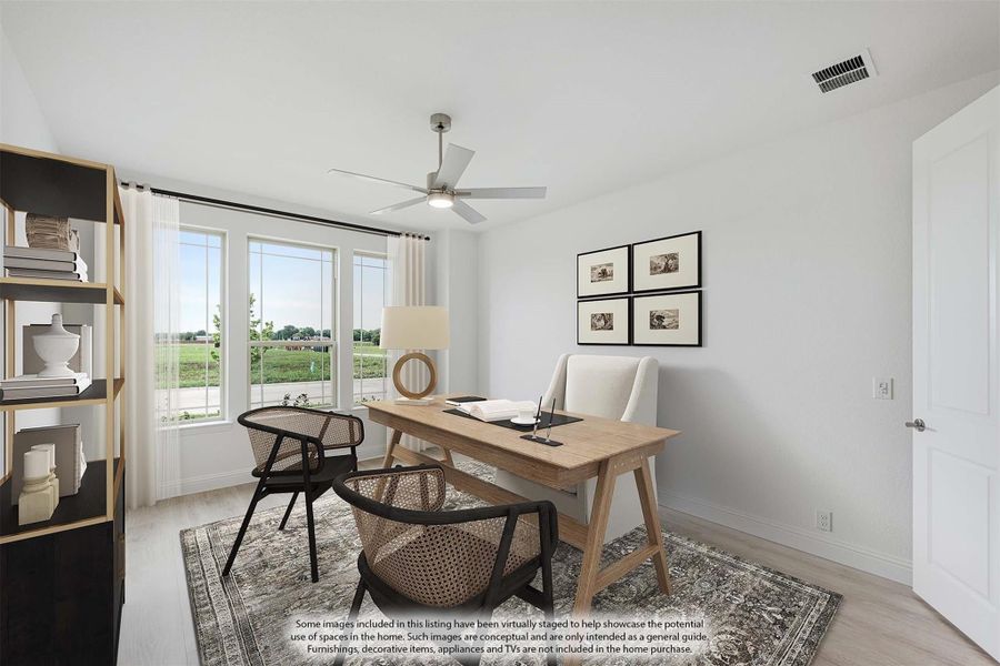 Home office with wood desk, ceiling fan, large window, and light hardwood floors Home office with wood desk, ceiling fan, large window, and light hardwood floors