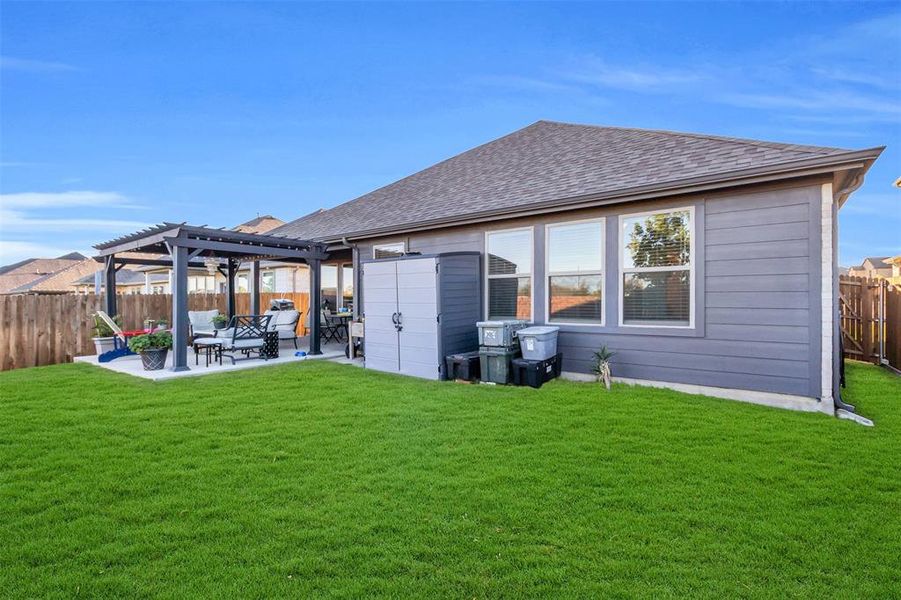 Back of house with a patio area, a pergola, and a yard