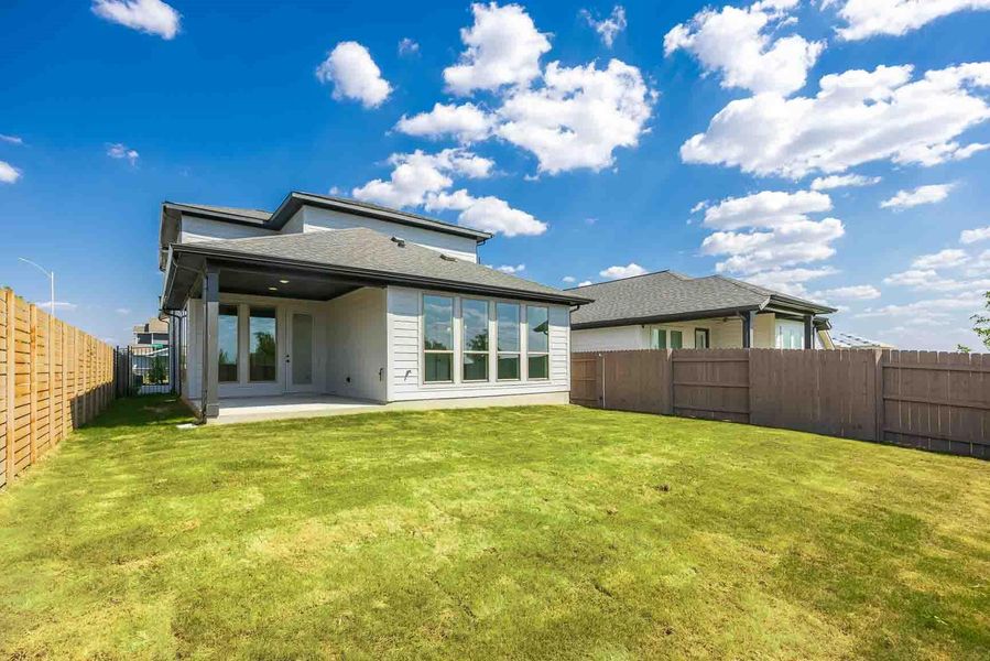Back of house with a patio and a fenced backyard Back of house with a patio and a fenced backyard