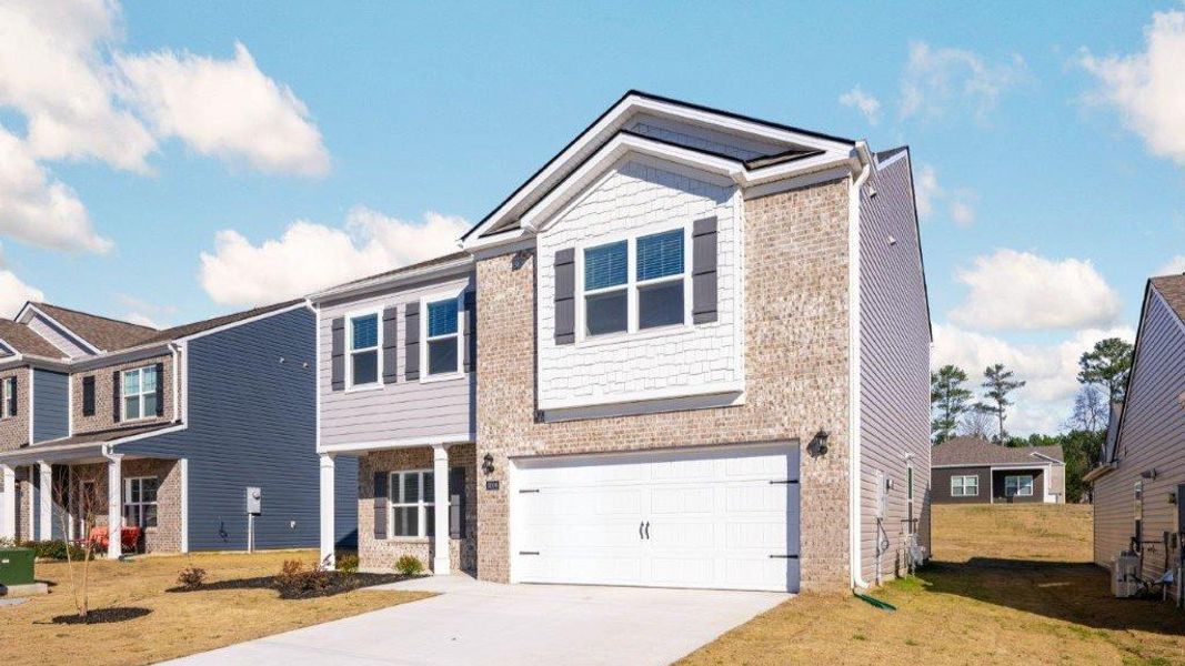 Front exterior of a new home in Hillcrest Landing, McDonald, TN, highlighting curb appeal (Image 14).