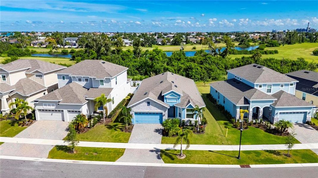 Front exterior of a new home in Marisol Pointe at MiraBay Florida Series, Apollo Beach, FL, highlighting curb appeal (Image 21).