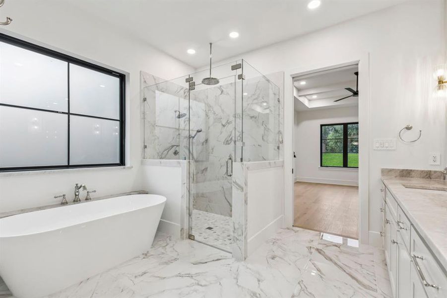 Full bathroom featuring a marble finish shower, vanity, a soaking tub, light marble finish floors, and ceiling fan