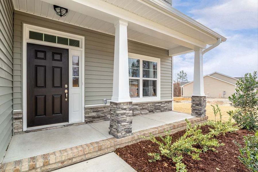 Representative exterior photo of a completed home built from the Pamlico by Caviness & Cates Communities in Bartlett Manor, Youngsville, NC (Image 19).