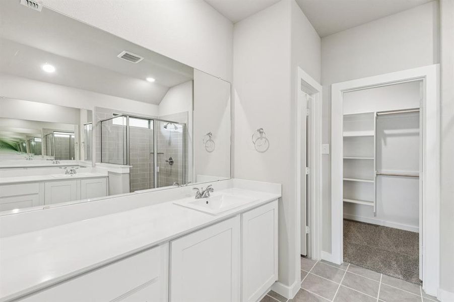 Primary Bathroom in the Heisman home plan by Trophy Signature Homes – REPRESENTATIVE PHOTO Primary Bathroom in the Heisman home plan by Trophy Signature Homes – REPRESENTATIVE PHOTO