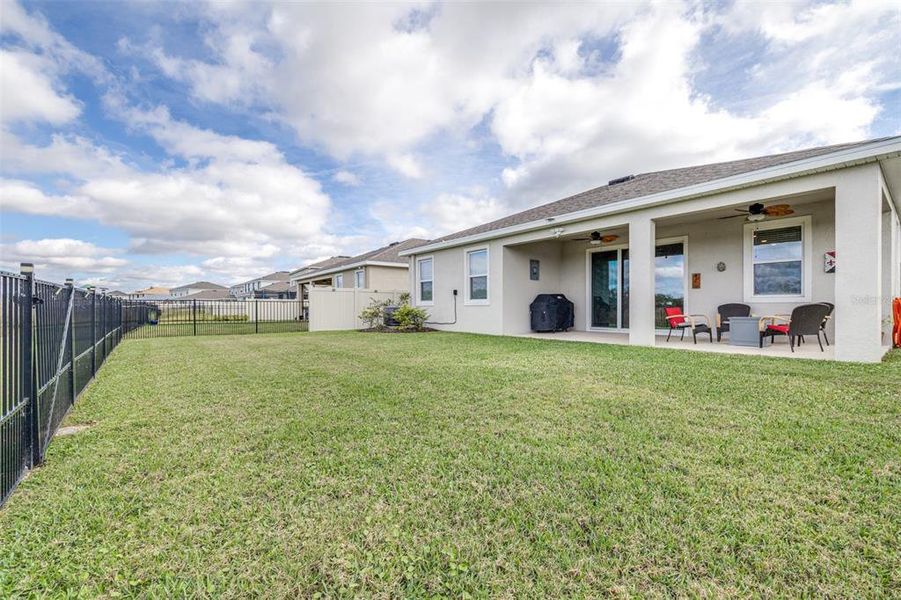 Exterior details and patio area of a home in Farm at Varrea, Plant City (Image 26).